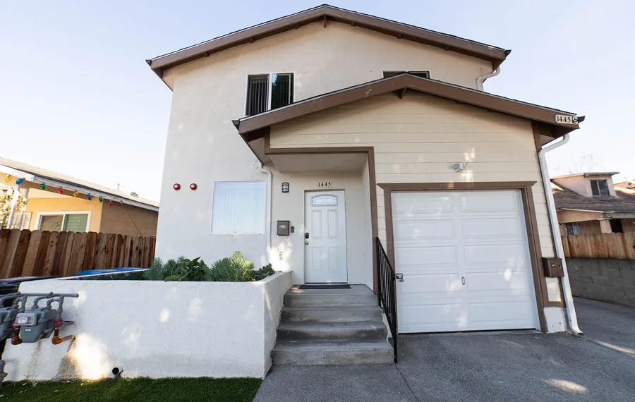 Front of the Wellness Housing men's house on East 54th Street in Los Angeles