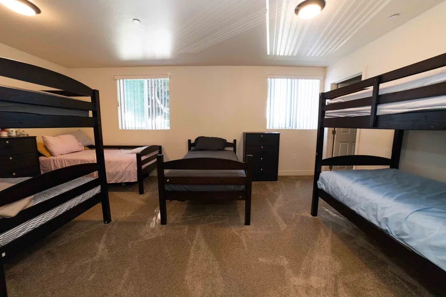 Shared bedroom with bunk beds and a single bed