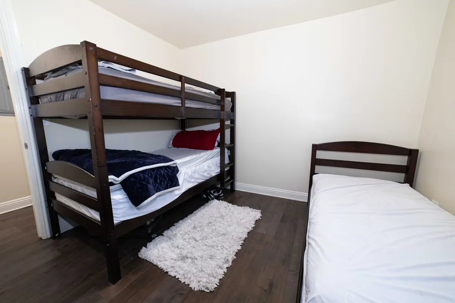 Shared bedroom with a bunk bed and a single bed